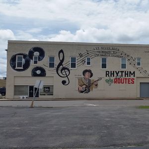 This mural in the town of Duncan where Hoyt Axton and his mother Mae Boren Axton once lived pays tribute to the country music stars. It includes lyrics from one of Hoyt's most famous songs and Mae Boren's hit she wrote for Elvis.