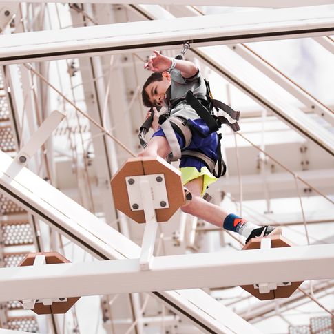 Test your balance and bravery at the Sandridge Sky Trail ropes course in Oklahoma City's Riversport Adventure Park.