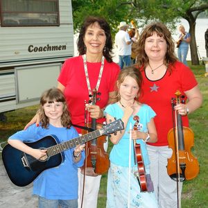 Jana with her daughter and granddaughters at Snider's Camp during the 2011 American Heritage Music Festival in Grove, Oklahoma

Left to right, top: Jana Jae and her daughter Sydni; bottom: Jana's granddaughters Robyn and Sandra
