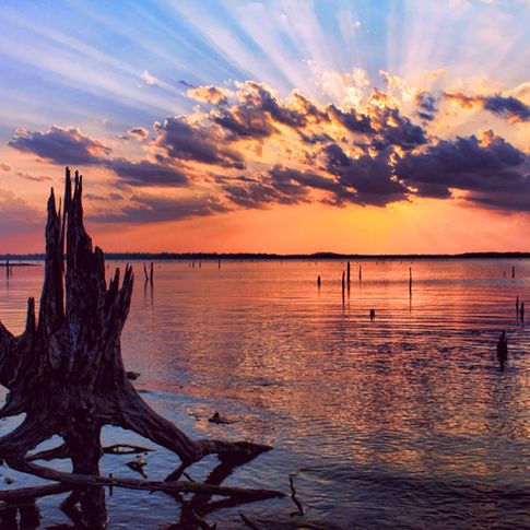 A dramatic sunset turns a Lake Eufaula cove into a dazzling waterscape.