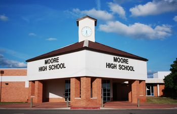 Toby Keith played football and attended classes at Moore High School.