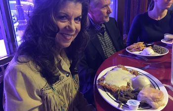 Jody Miller enjoys the famous chicken fried steak dinner at Kendall's Restaurant in Noble, Oklahoma. Kendall's features displays of Oklahoma memorabilia including Jody Miller album art.