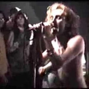 Tyson Meade singing at a 1990 Chainsaw Kittens performance at Rome in Norman, Oklahoma