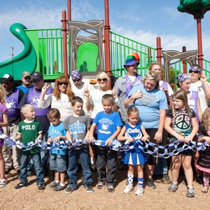Carrie Underwood (second row, center) helped make a new playground a reality for her hometown through the KaBOOM program in October 2011.