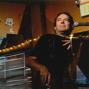 Double exposure image of Jimmy Webb performing at The Blue Door in 2006