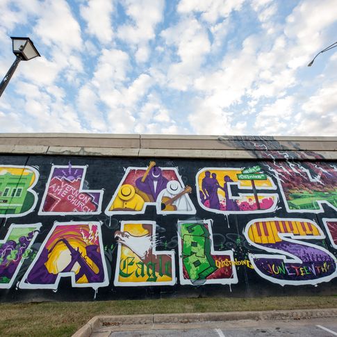 Local artist Chris "Sker" Rogers envisioned a new mural that artist Donald "Scribe" Ross painted on the Greenwood Cultural Center wall in the summer of 2018.