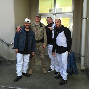 Color Me Badd poses with a member of the United States Army following their performance for soldiers and community at Camp Zama, Japan in September, 2015.