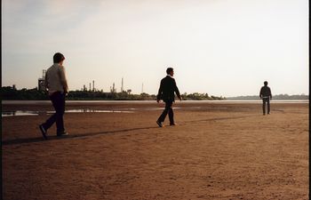The Hanson brothers walk along the Arkansas River in Tulsa during a 2007 photo shoot for "The Walk," their fourth studio album. 