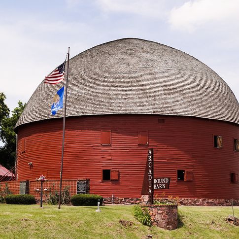 Built by local farmer William Harrison Odor in 1898 using native bur oak boards, the Round Barn in Arcadia is one of the most-photographed attractions along Route 66.