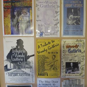 Woody Guthrie tribute posters on the wall at The Blue Door
