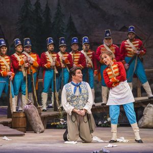 Sarah Coburn with soldiers at the Tulsa Opera's production of La Fille du Regiment