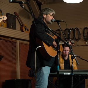 Tom Skinner performs with John Fullbright at the 2014 Woody Guthrie Tribute Show at the Blue Door.