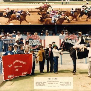 Jody Miller, pictured wearing a yellow jacket, posed for a photo with their winning horse after the All American Futurity Consolation Quarter Horse Race in Ruidoso Downs, New Mexico in 1986. Jody and her husband Monty's farm once had around 90 horses, and once Remington Park opened, the Brooks family stabled their designated race horses at the track.