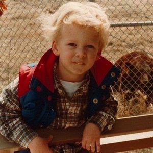 A young Ryan Tedder poses for a photo with a bear at the Tulsa Zoo.