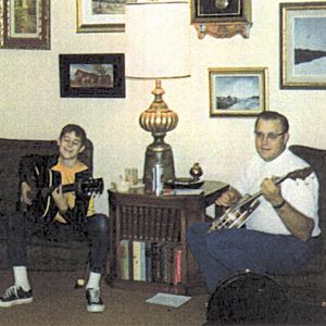 Vince Gill plays his first guitar in his childhood home in Oklahoma City.