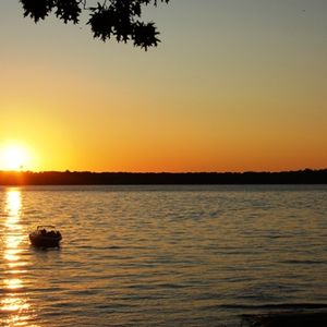 Enjoy a serene sunset on the lake at the Cherokee Area at Grand Lake.
