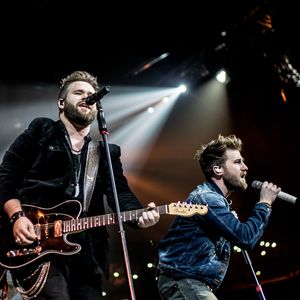 The Swon Brothers performing at Memphis Fed Ex Forum on the Carrie Underwood STORYTELLER Tour